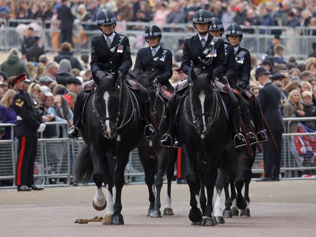 Mounted Metropolitan Police take part during the procession ahead of the state funeral. Photo: Getty