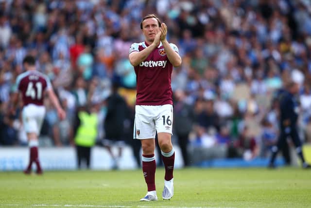 Mark Noble of West Ham applauds the fans after playing his final game during the Premier League match. (Photo by Charlie Crowhurst/Getty Images)