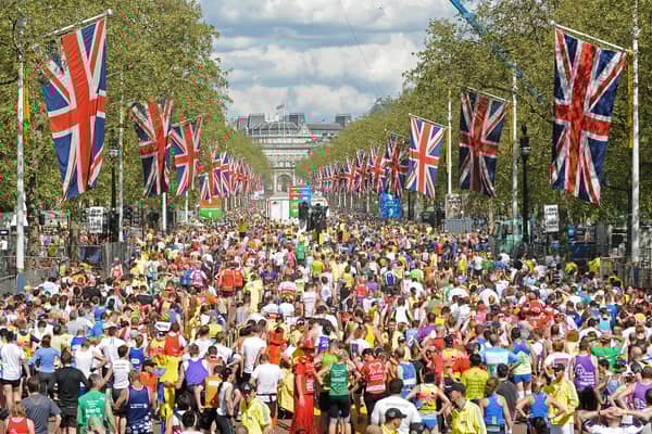 Runners fill the road after crossing the finish Line near Buckingham Palace during the 2009 London Marathon