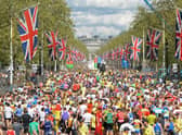 Runners fill the road after crossing the finish Line near Buckingham Palace during the 2009 London Marathon