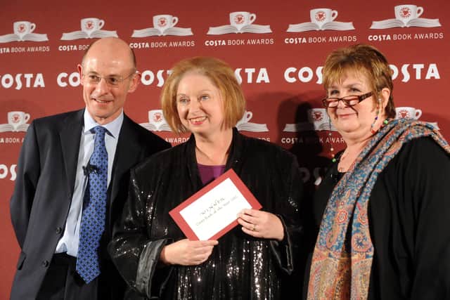 Chris Rogers, Hilary Mantel (centre) and Dame Jenni Murray attend the Costa Book of the Year awards in 2013. Photo: Getty