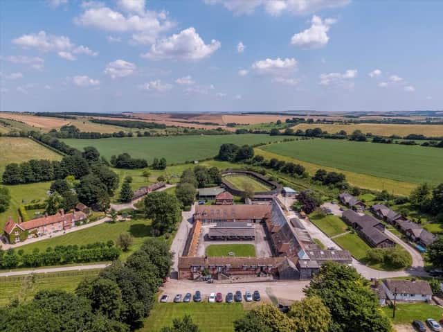 The 63 acre property includes a main house, stables and a big office space.