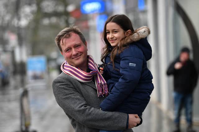 Richard Ratcliffe poses for pictures with Gabriella in his arms, after the announcement of his wife’s release. Photo: Getty