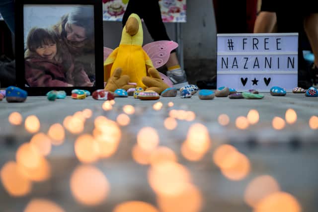 A photo of Nazanin Zaghari-Ratcliffe and her daughter Gabriella is seen amongst candles during a fourth birthday vigil for Gabriella. Photo: Getty