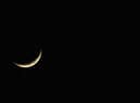 The planet Venus appears close to the crescent Moon as Jupiter (R) appears nearby during a rare planetary alignment in 2008.