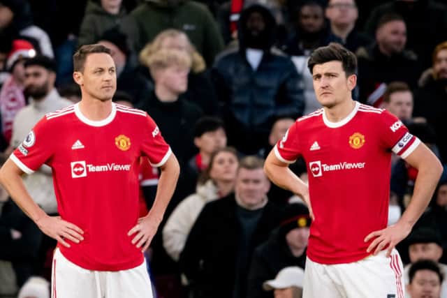  Nemanja Matic looks on with Harry Maguire of Manchester United during the Premier League match (Photo by Ash Donelon/Manchester United via Getty Images)