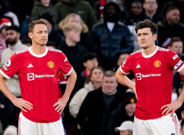 <p> Nemanja Matic looks on with Harry Maguire of Manchester United during the Premier League match. (Photo by Ash Donelon/Manchester United via Getty Images)</p>