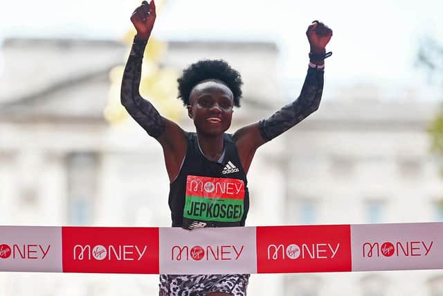 Joyciline Jepkosgei of Kenya celebrates winning the Women's Elite Race during the 2021 Virgin Money London Marathon