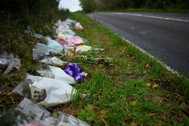 Flowers left in remembrance of Harry Dunn on the B4031 near RAF Croughton. Photo: Getty