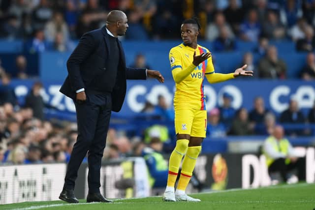 Patrick Vieira, Manager of Crystal Palace interacts with Wilfried Zaha of Crystal Palace (Photo by Gareth Copley/Getty Images)