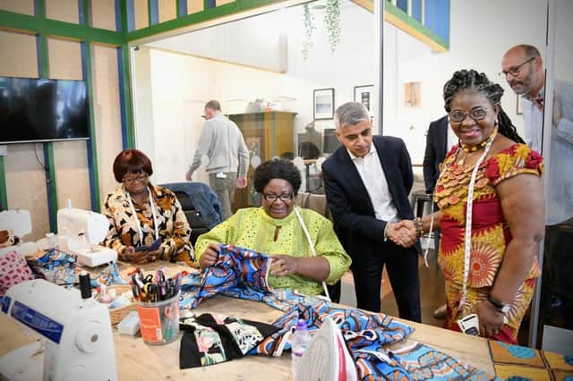 Sadiq Khan with traders at the Blue Market in Bermondsey