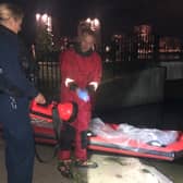Marine Unit officers recovering the bodies of four dogs that were found dead inside plastic bags in Southmere Lake. Photo: Vicki Hudson / SWNS