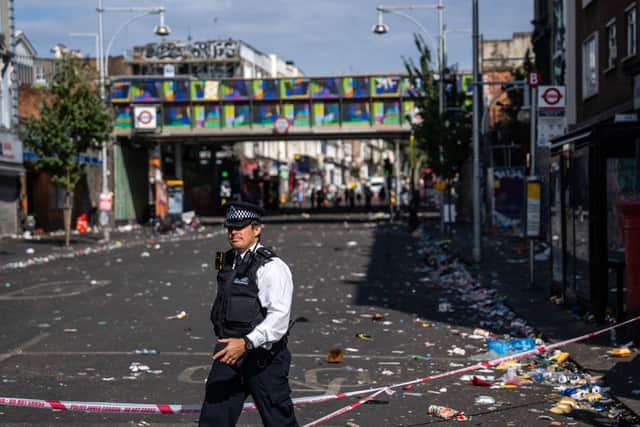 A police officer at the scene of a fatal stabbing during the Notting Hill Carnival. Photo: Getty
