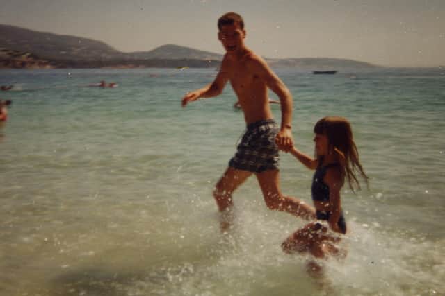 Ricky at the beach with his daughter. Photo: Met Police