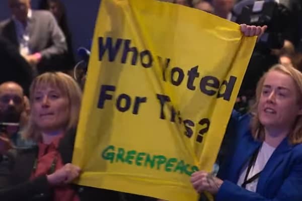 Protestors heckle Prime Minister Liz Truss during her keynote speech at the Conservative Party Conference 2022 in Birmingham.