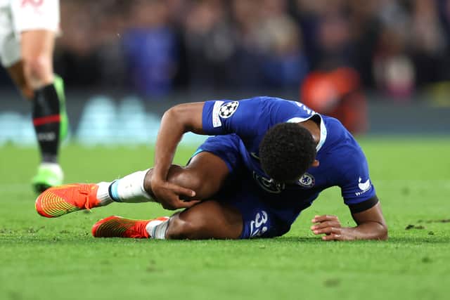 Wesley Fofana of Chelsea is seen injured during the UEFA Champions League group E (Photo by Catherine Ivill/Getty Images)