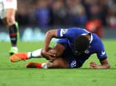 Wesley Fofana of Chelsea is seen injured during the UEFA Champions League group E match (Photo by Catherine Ivill/Getty Images)