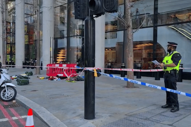 Police at the scene after three people were taken to hospital following reports of stabbings at Bishopsgate in London.