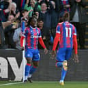 Crystal Palace's English midfielder Eberechi Eze (L) celebrates scoring the team's second goal during the English Premier League 