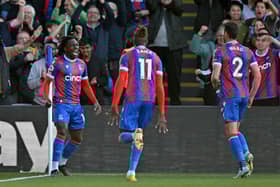 Crystal Palace's English midfielder Eberechi Eze (L) celebrates scoring the team's second goal during the English Premier League 