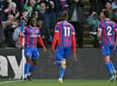 Crystal Palace's English midfielder Eberechi Eze (L) celebrates scoring the team's second goal during the English Premier League 