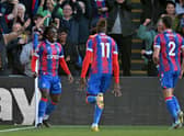 Crystal Palace's English midfielder Eberechi Eze (L) celebrates scoring the team's second goal during the English Premier League 