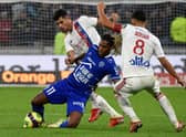 Bruno Guimaraes and Houssem Aouar fights for the ball during the game against Troyes in September 2021 (Photo by JEAN-PHILIPPE KSIAZEK / AFP)