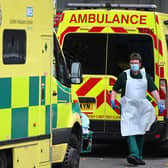 A paramedic walks past ambulances outside the Royal London Hospital. Photo: Getty