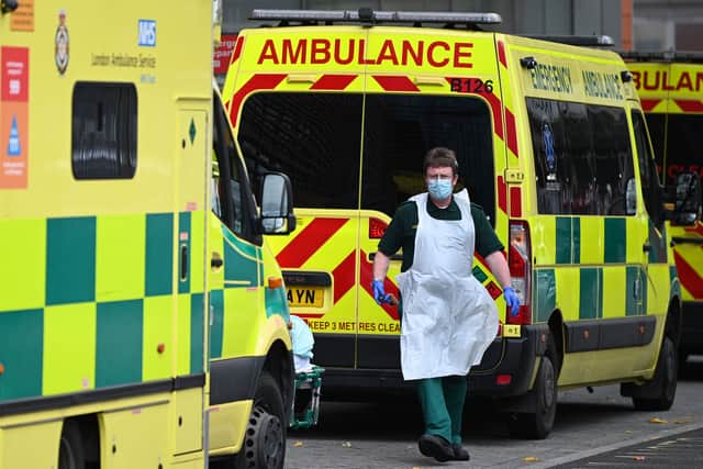 A paramedic walks past ambulances outside the Royal London Hospital. Photo: Getty