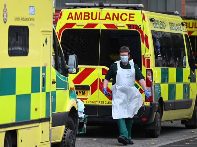 A paramedic walks past ambulances outside the Royal London Hospital. Photo: Getty