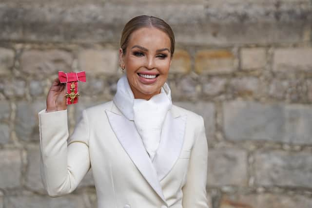 Katie Piper poses with her OBE medal at Windsor Castle in 2022. (Photo by Steve Parsons - WPA Pool/Getty Images)