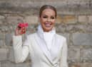 Katie Piper poses with her OBE medal at Windsor Castle in 2022. (Photo by Steve Parsons - WPA Pool/Getty Images)