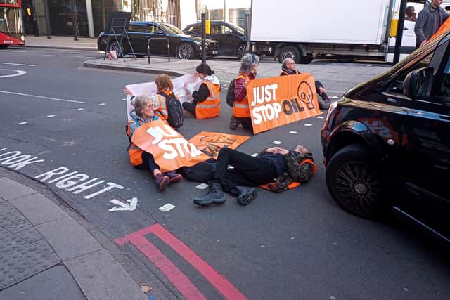 Just Stop Oil protestors have glued themselves to the tarmac in Knightsbridge