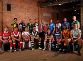 The 16 captains with the Rugby League World Cup Trophy ahead of first round of fixtures