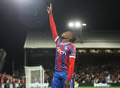 Wilfried Zaha of Crystal Palace celebrates after scoring their team's first goal during the Premier League (Photo by Eddie Keogh/Getty Images)
