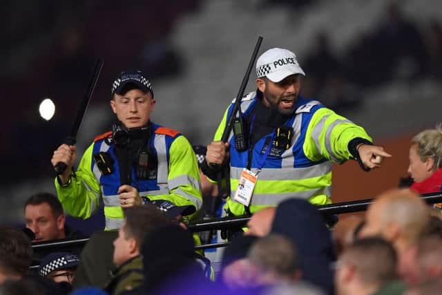  Metropolitan Police officers control fans after tempers flare between fans of Anderlecht (Photo by Justin Setterfield/Getty Images)