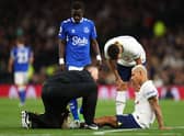 Richarlison of Tottenham Hotspur receives medical treatment during the Premier League match  (Photo by Julian Finney/Getty Images)