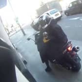Motorcyclist confronts angle grinder-wielding thugs