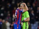  Joachim Andersen of Crystal Palace embraces teammate Vincente Guaita following their side's victory  (Photo by Justin Setterfield/Getty Images)