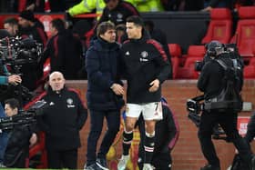 Antonio Conte of Tottenham Hotspur embraces Cristiano Ronaldo of Manchester United (Photo by Michael Regan/Getty Images)