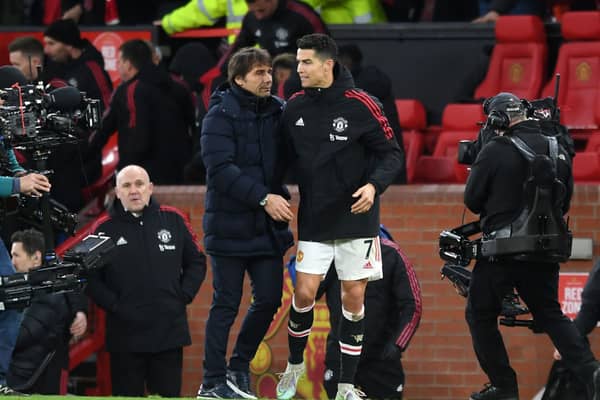 Antonio Conte of Tottenham Hotspur embraces Cristiano Ronaldo of Manchester United (Photo by Michael Regan/Getty Images)
