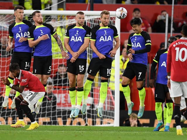 Tottenham Hotspur’s Croatian midfielder Ivan Perisic, Tottenham Hotspur’s Danish midfielder Pierre-Emile Hojbjerg, Tottenham  (Photo by OLI SCARFF/AFP via Getty Images)