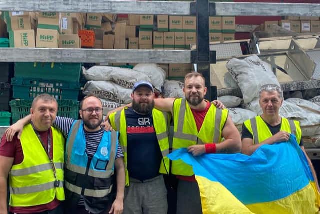 Mykhailo Kharkovoi (fourth from the right) has been delivering aid to his country from the UK since the war started