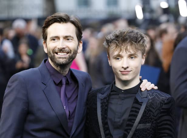 <p>David Tennant (L) and his son Ty Tennant (R) pose on the red carpet in 2019 (Pic: AFP via Getty Images)</p>