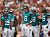 Quarterback Trevor Lawrence #16 of the Jacksonville Jaguars looks on against the Washington Commanders at FedExField on September 11, 2022