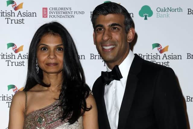 Rishi Sunak with his wife Akshata Murthy (left)