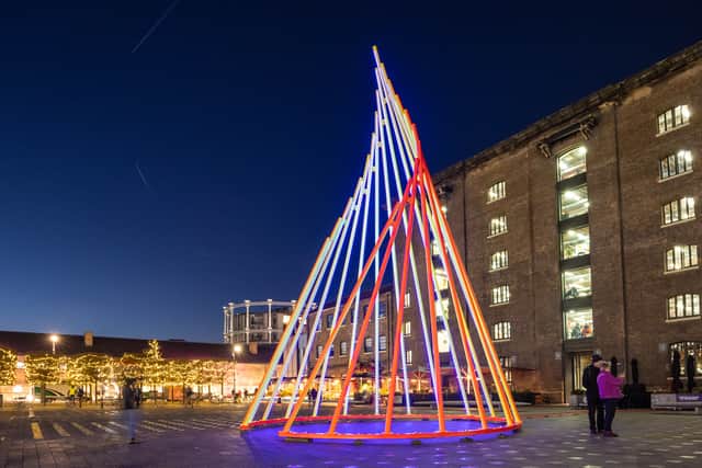 The striking, 11ft high geometric winter sculpture Temenos, created by trailblazing artist Liliane Lijn, has a new home at Cubitt Square. 