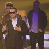 Robbie Williams and other members of the UK band "Take That" walk offstage after receiving their International Band Rock/Pop Award at the Echo Awards 201