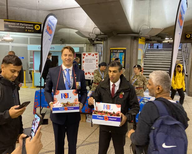 PM Rishi Sunak selling poppies at Westminster Tube Station this morning. Photo: Sara Le Roux