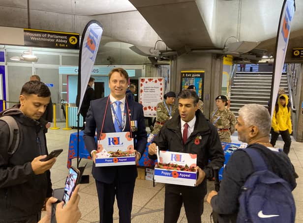 <p>PM Rishi Sunak selling poppies at Westminster Tube Station this morning. Photo: Sara Le Roux</p>